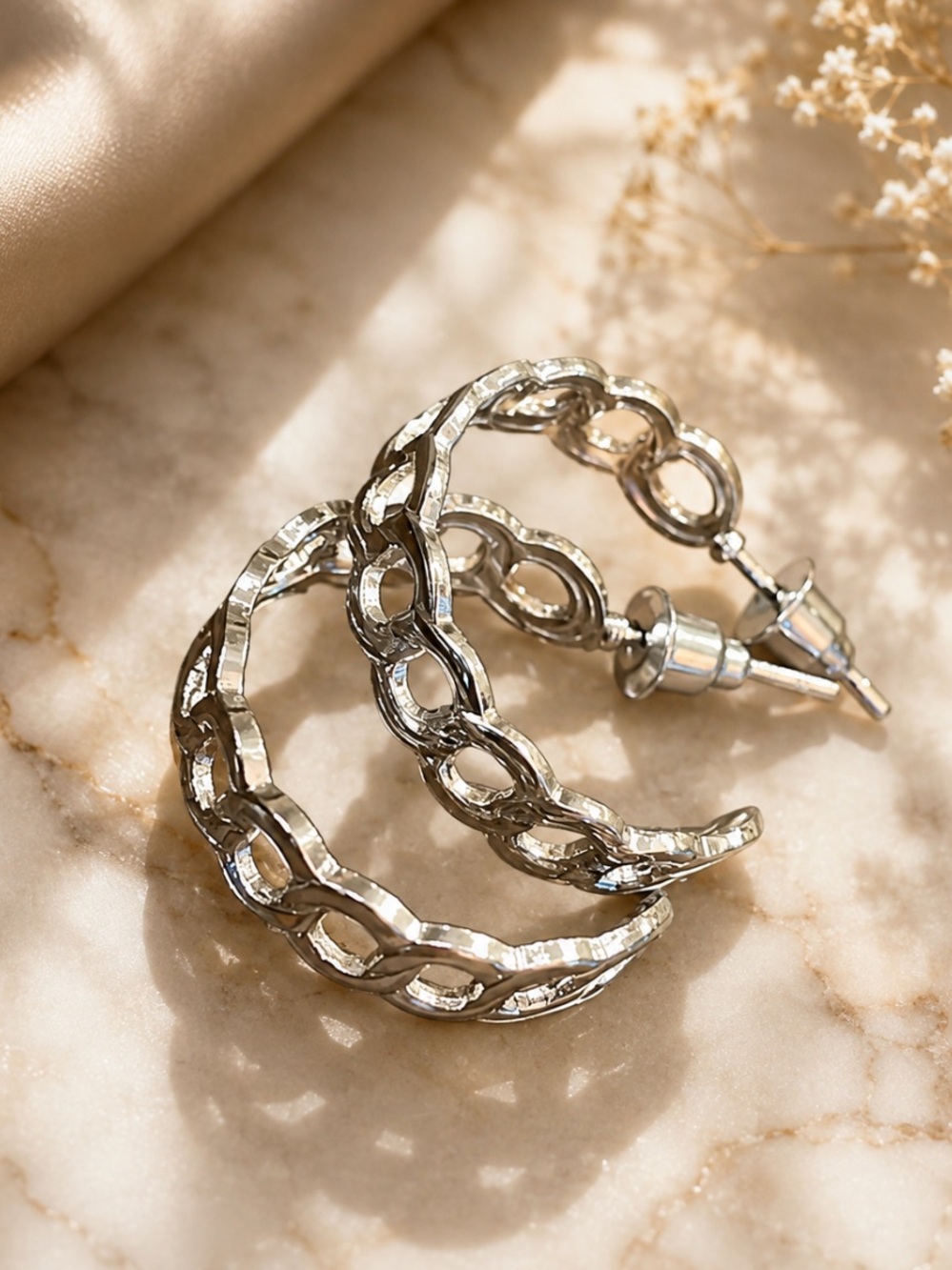 Silver cutout hoop earrings